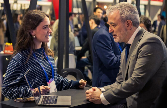 Metascan team member meeting with an institutional representative at an event